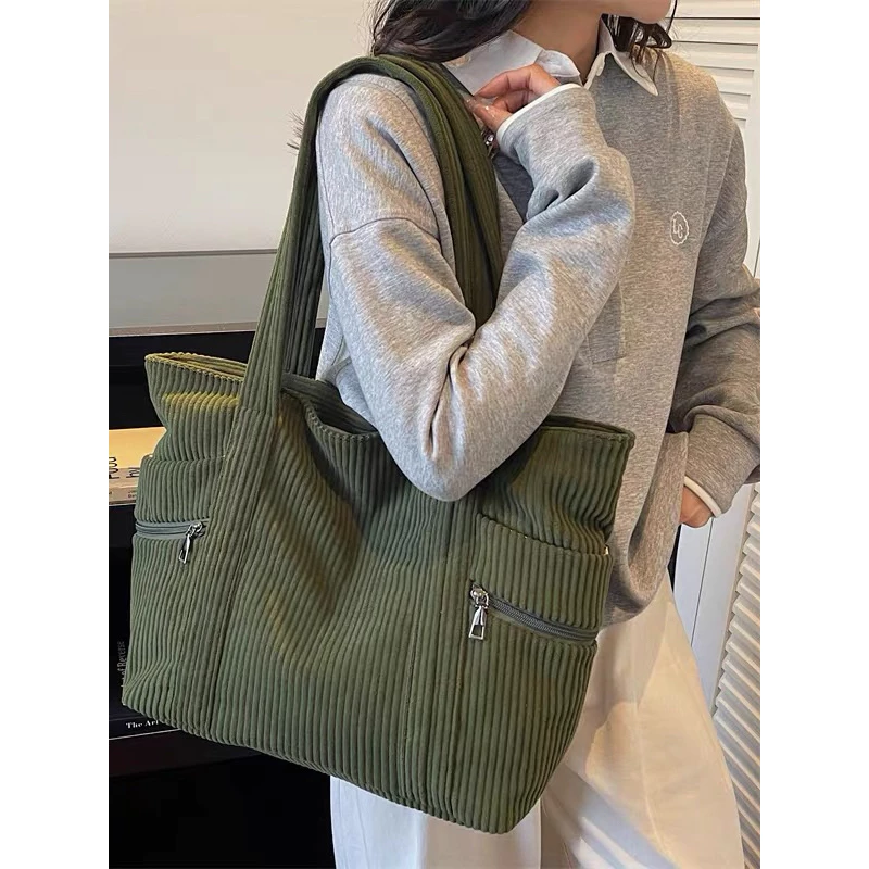 (2240) This corduroy bag is spacious, has a zippered pocket, and is both practical and stylish. image 2