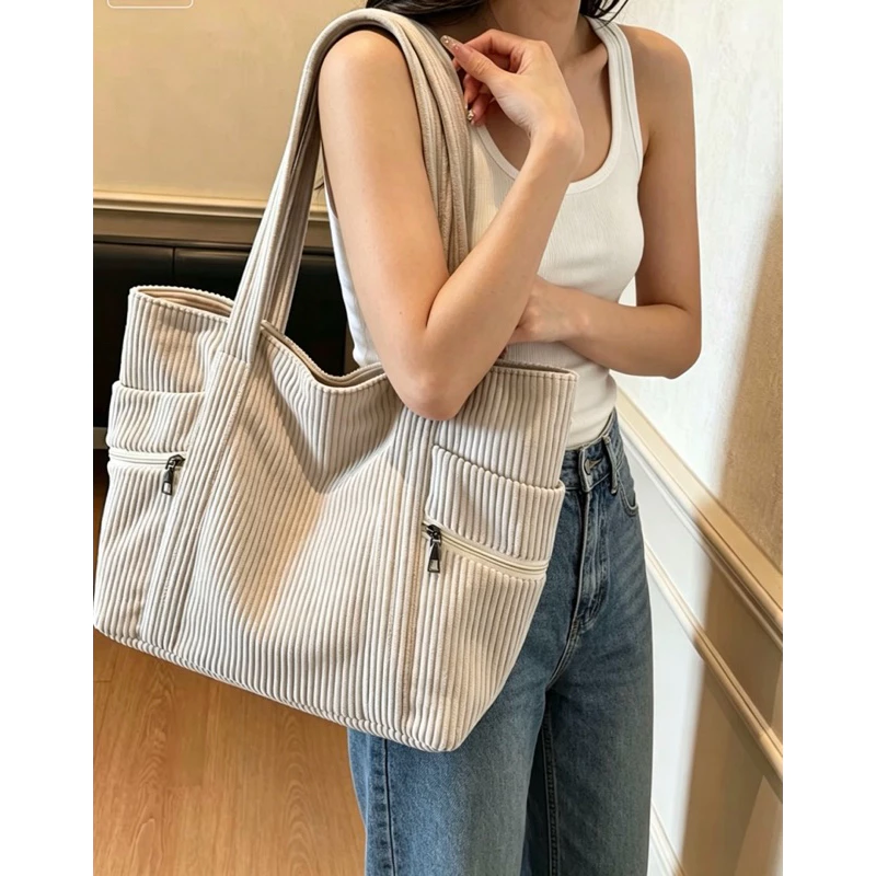 (2240) This corduroy bag is spacious, has a zippered pocket, and is both practical and stylish. image 3
